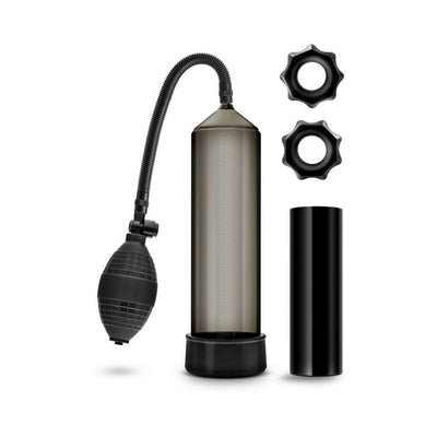Blush Quickie Kit in black featuring a suction pump, flexible tube, stroke sleeve, and two stretchy rings.