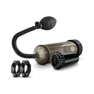 Blush Quickie Kit in black featuring a suction pump, textured stroke sleeve, and two stretchy cock rings on white background.