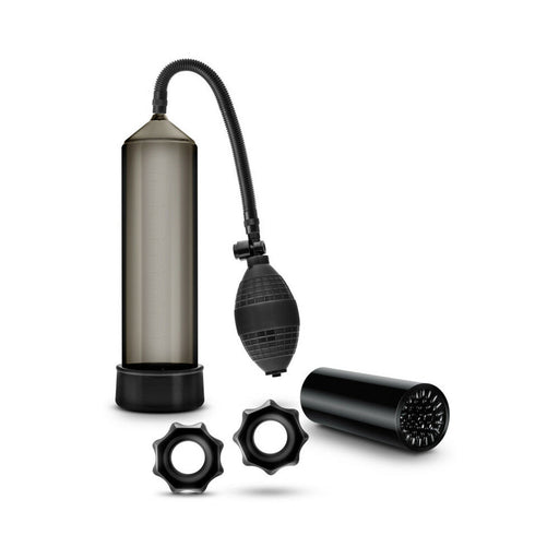 Blush Quickie Kit in black featuring a suction pump, flexible stroke sleeve, and two textured cock rings on white background.