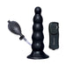 Black inflatable anal expander with bulb pump and remote control for adjustable vibration and inflation.