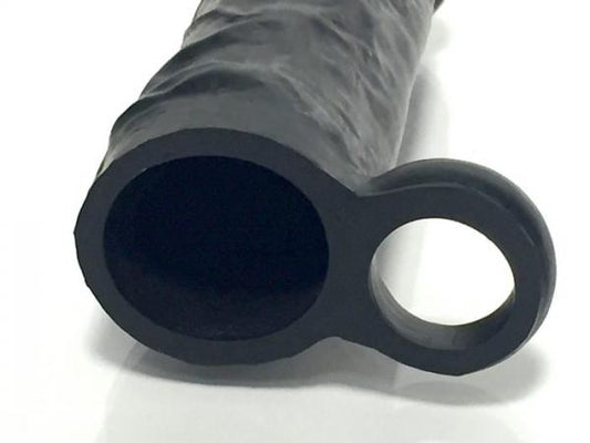 Close-up of black silicone extender with integrated ring, designed for comfortable size enhancement and secure fit.
