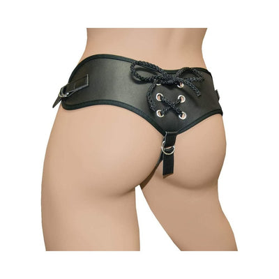 Back view of black adjustable harness with lace-up detail and metal rings worn on hips