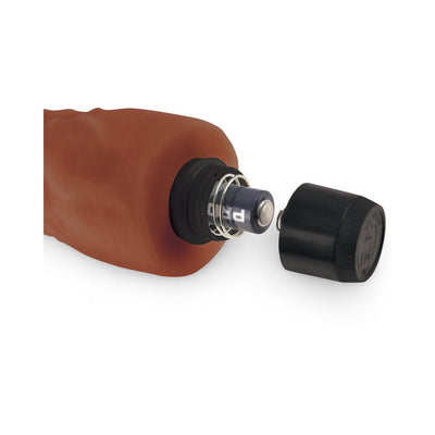 Close-up of the brown Real Feel Lifelike Toyz No.2 vibrator showing the battery compartment with the cap removed and one AA battery inserted.