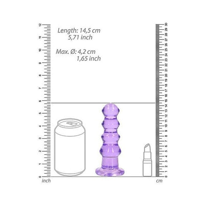 Purple crystal clear curvy 5.5 inch dildo with suction base shown next to soda can and lipstick for size comparison.