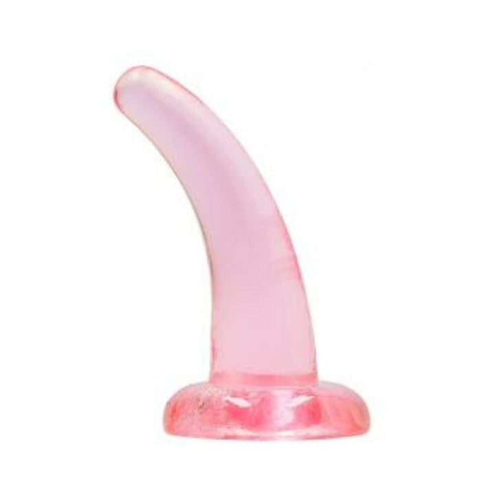 Pink crystal clear curved dildo with suction cup base on white background