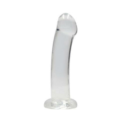 Crystal clear curved dildo with suction cup base for hands-free use, made from smooth, body-safe material.