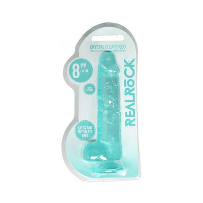 Turquoise crystal clear realistic dildo with suction cup and balls in retail packaging.