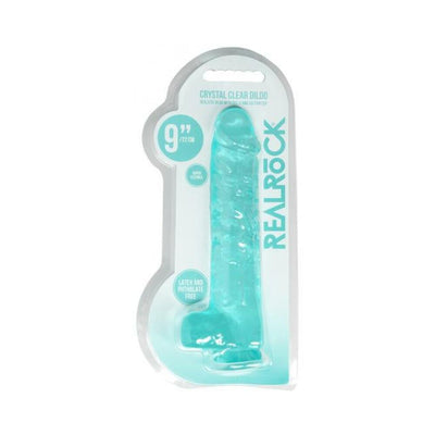 Turquoise 9-inch realistic dildo with balls in clear packaging labeled Realrock, latex and phthalate free.