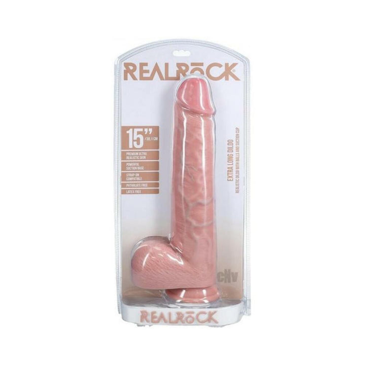 Realrock 15-inch beige dildo with realistic veins, scrotum, and suction cup in clear retail packaging.