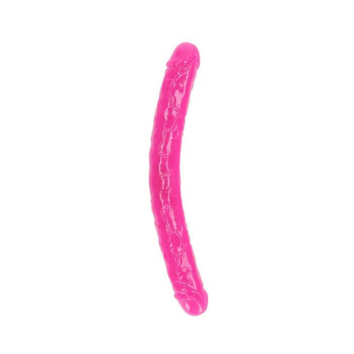 Bright pink glow-in-the-dark dual-ended flexible dildo with realistic texture and curved design.