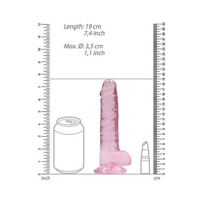 Pink realistic dildo with suction base, shown next to a soda can and lipstick for size comparison, measuring 7.4 inches tall.
