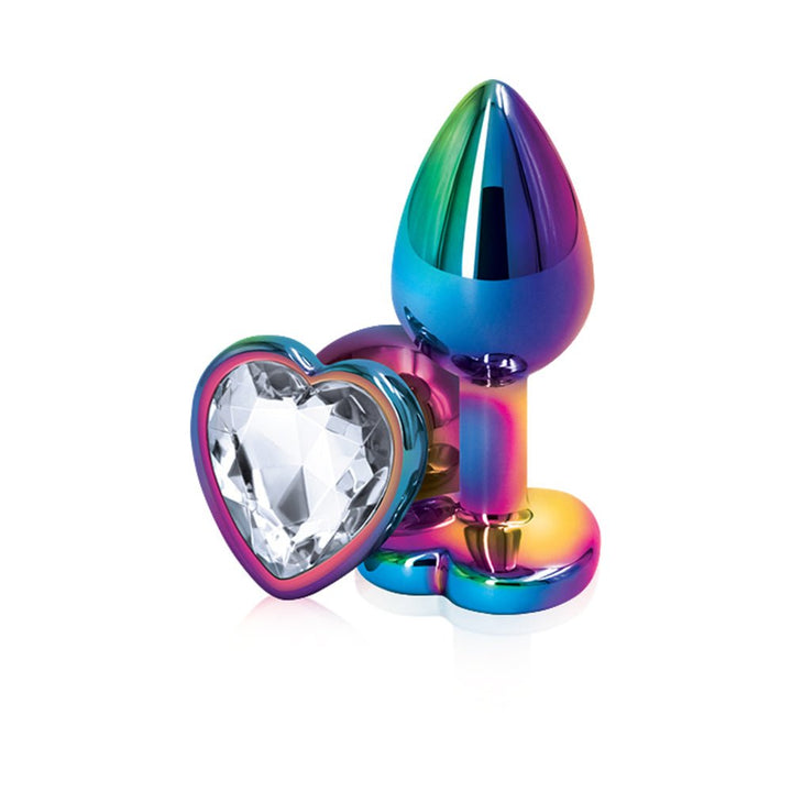 Small rainbow chrome-plated anal plug with a heart-shaped clear gem base on a white background.