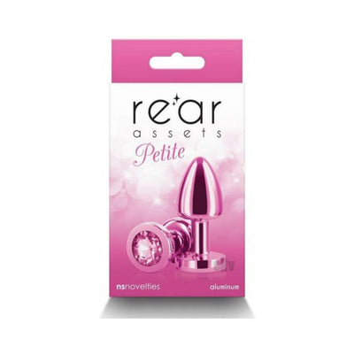Pink petite metal anal plug with jewel base displayed on pink and white packaging box.