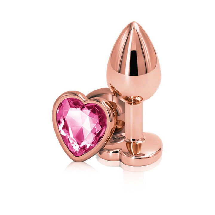 Rose gold small metal plug with a pink heart-shaped gem base, sleek and polished design.