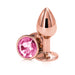 Rose gold small metal plug with a faceted pink gem base, polished and reflective finish.