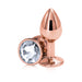 Small rose gold chrome-plated aluminum anal plug with clear gem base, designed for beginners and easy cleaning.