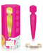 Pink Rianne S Bella Mini Body Wand with packaging and an inspirational gold-tone ring accessory.