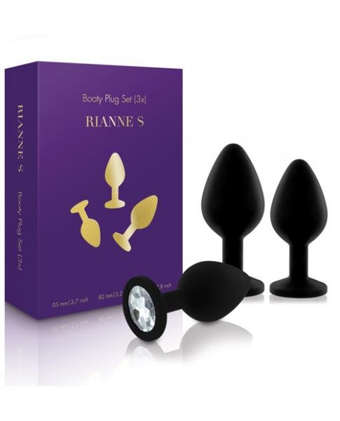 Set of three black silicone booty plugs with gem-like stone bases displayed next to purple Rianne S packaging box.