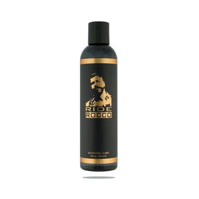 Black bottle of Ride Rocco silicone lubricant with gold accents and logo, 8.5 oz size.