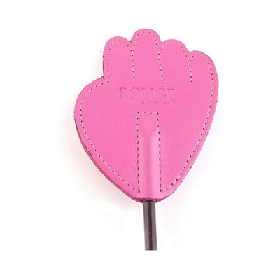 Close-up of a pink leather riding crop tip shaped like a hand with detailed stitching and embossed branding.