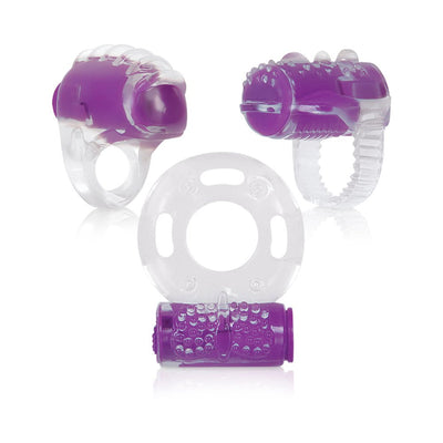 Three clear and purple vibrating pleasure rings with textured surfaces in a 3-piece set by Evolved.