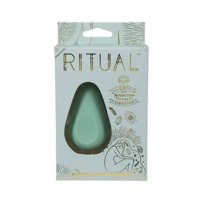 Mint green Ritual Chi rechargeable silicone clitoral vibrator in decorative light blue and gold packaging.