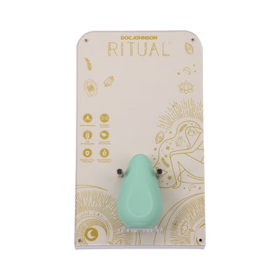 Mint green Ritual Chi rechargeable silicone clitoral vibrator displayed on decorative beige and gold packaging.