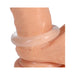 Close-up of a translucent soft silicone ring worn around the base of a realistic skin-toned model.