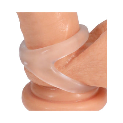 Close-up of a translucent silicone cock ring designed to support and elevate the base and testicles.