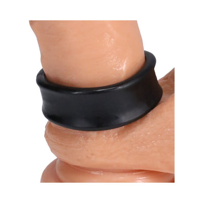 Black convex C ring worn on a finger, showcasing its flexible and smooth design.
