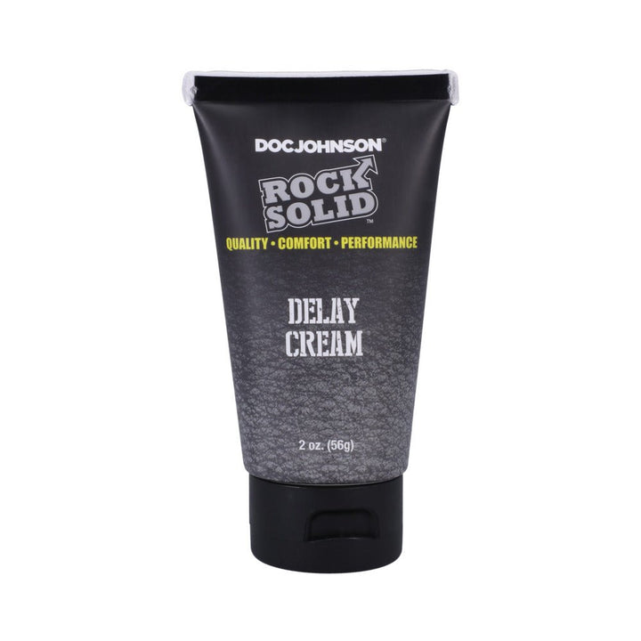 Tube of Doc Johnson Rock Solid Delay Cream 2oz with black and gray textured design and yellow text.