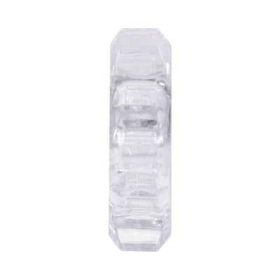 Clear flexible stretchy ring with ridged texture shown in transparent clamshell packaging on white background.