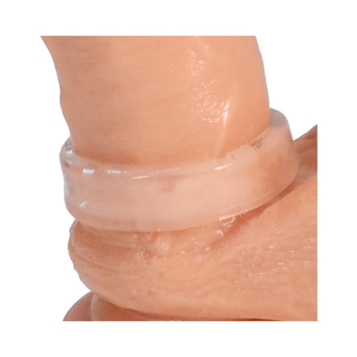 Clear stretchy cock ring worn on a realistic skin-toned model for size and fit demonstration.