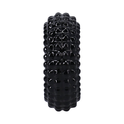 Black textured stretchy ring with raised ridges for a flexible and comfortable fit.