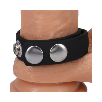 Black adjustable Silaflex ring with five metal snap closures shown on a skin-toned model for fit demonstration.
