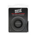 Small black silicone ring in clear clamshell packaging with Rock Solid branding and product details.