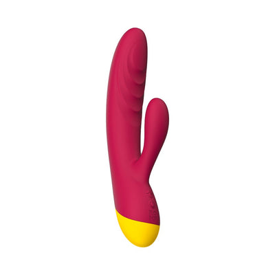 Magenta and yellow dual-stimulation rabbit vibrator with textured shaft and ergonomic design.