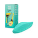 Mint green leaf-shaped Romp Wave vibrator with matching packaging box in the background.
