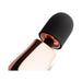 Compact rosy gold mini massager with a soft black silicone head and sleek ergonomic design.
