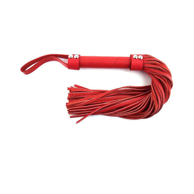 Red leather flogger with multiple soft tails and a wrist loop on a white background.