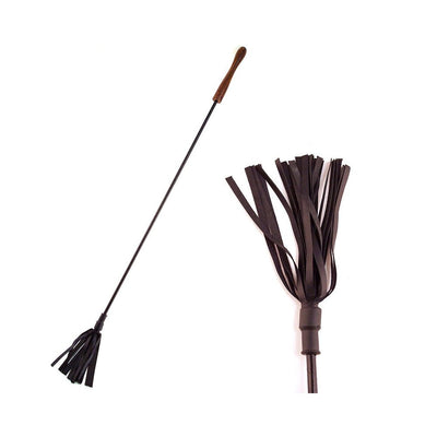 Black leather riding crop with multiple leather strips and a smooth wooden handle on a white background.