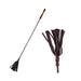 Black leather riding crop with multiple leather strips and a smooth wooden handle on a white background.
