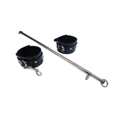 Adjustable 30-inch tubular steel leg spreader bar with black leather cuffs and metal hardware on white background.