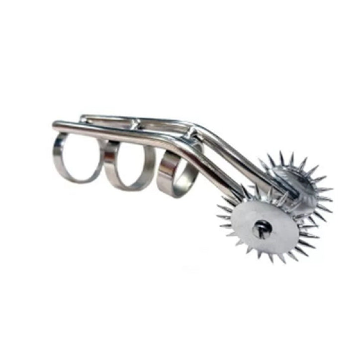 Stainless steel finger accessory with three adjustable rings and dual spiked pinwheels for sensory stimulation.