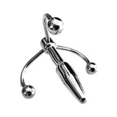 Polished stainless steel crown-shaped penis plug with three rounded hooks for safe and stimulating wear.