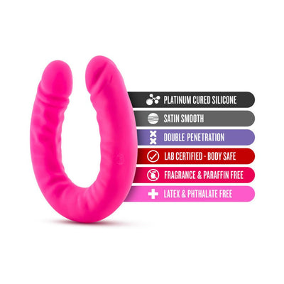 Bright pink double-ended silicone toy with product features listed including body safe, satin smooth, and latex free.