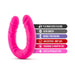 Bright pink double-ended silicone toy with product features listed including body safe, satin smooth, and latex free.