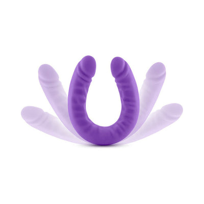 Purple 18-inch flexible double-ended silicone dildo with realistic texture and slim design shown bending.