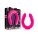 Bright pink 18-inch slim double-ended silicone dildo with realistic texture, shown inside and outside its black and purple packaging.