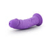 Purple realistic curved dildo with suction cup base on white background